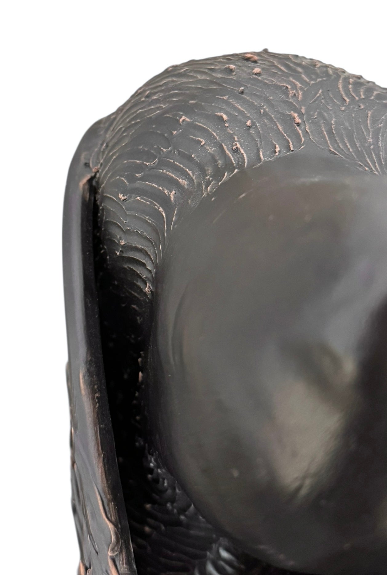 A dark, chocolate-brown ceramic sculpture by Enza Fasano depicting the stylized head of a hunting dog, such as a pointer or hound. The piece features a smooth, elongated snout and large, floppy ears with a textured, feathery finish that contrasts with the sleek crown of the head. The minimalist design emphasizes the dog's elegant profile and long neck.
