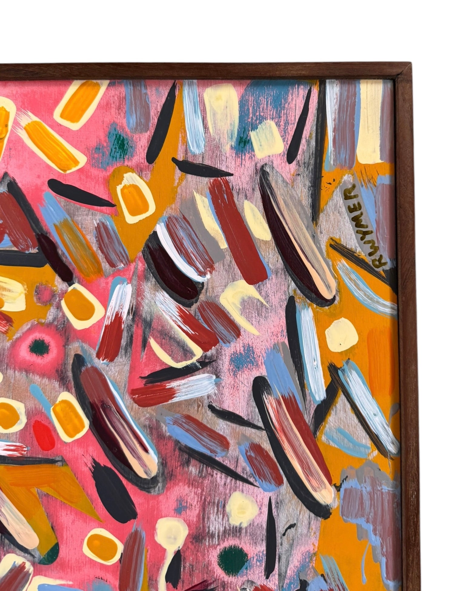 An abstract painting titled 'Cascade of Gold and Pink' by Robert Wymer, framed in dark wood. The artwork features a vibrant pink background densely covered with a dynamic arrangement of multi-directional, oblong, and dash-like brushstrokes in gold, red, blue, gray, white, and black.