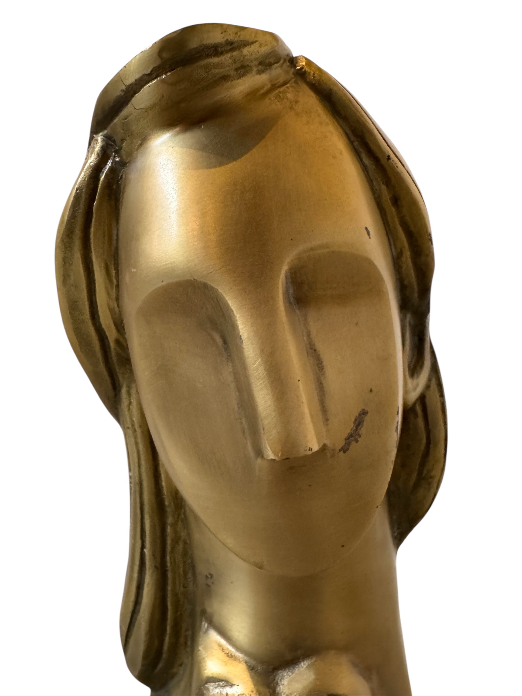 Cast bronze bust of a woman, mid-century Korean design, on a dark wood base. The figure has stylized flowing hair and no mouth.