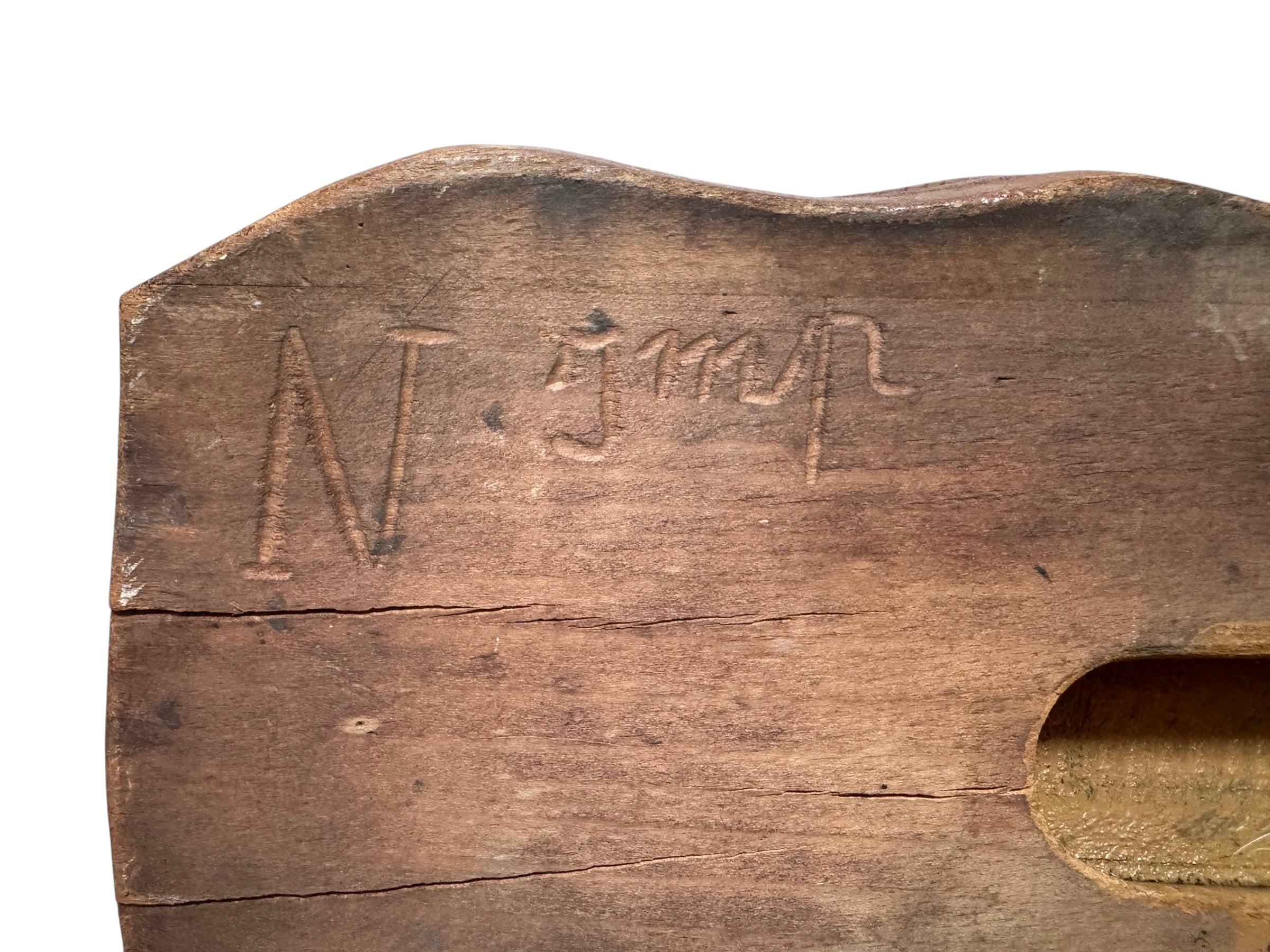 A vintage carved wooden printing block with intricate, repeating patterns, engraved with an unknown artist's signature and stamped "Made in France." The wood shows signs of age and wear, adding to its historical character