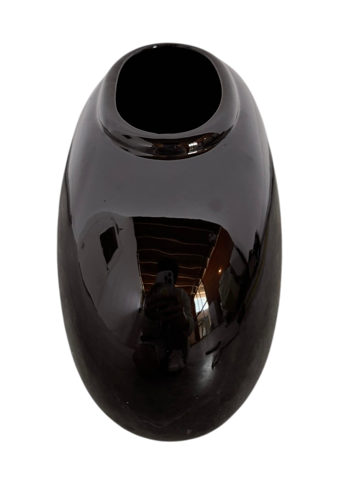 A round, glossy black vase with a small opening.
The vase has a spherical or gourd-like shape and a highly reflective, black glazed finish.