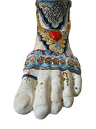 Ceramic foot sculpture by Domenico Pinto featuring hand-painted details, gold accents, a sacred heart, and an angel figure with a blindfold