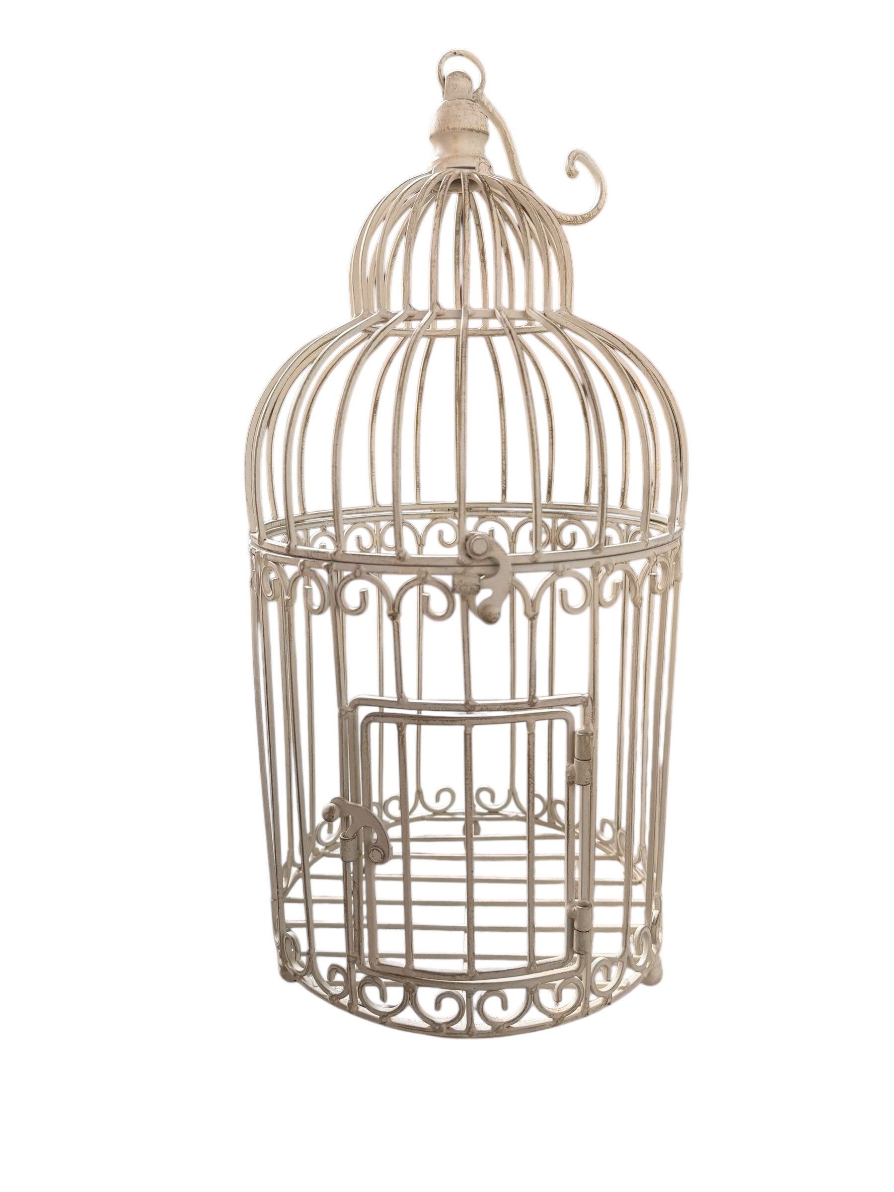 A single, white or cream-colored, decorative wrought iron bird cage with a hinged door and a hanging loop at the top. The cage has a vintage or antique style 