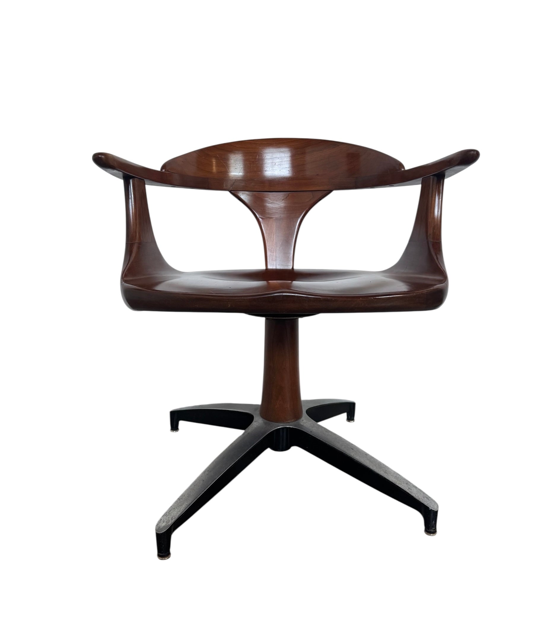 Mid-century modern Cliff House dining chair by Heywood Wakefield, cherry wood with black base.
1960s Cliff House Swivel Chair: A Mid-Century Icon by Heywood Wakefield
