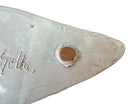 A white glazed ceramic platter in the shape of a prickly pear cactus pad with attached prickly pear fruit. The surface has raised dots representing spines