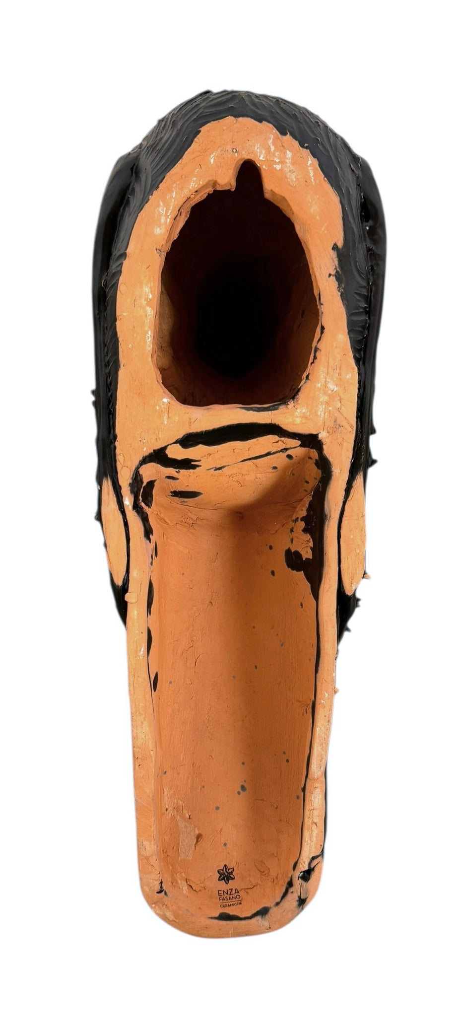 A dark, chocolate-brown ceramic sculpture by Enza Fasano depicting the stylized head of a hunting dog, such as a pointer or hound. The piece features a smooth, elongated snout and large, floppy ears with a textured, feathery finish that contrasts with the sleek crown of the head. The minimalist design emphasizes the dog's elegant profile and long neck.