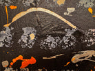 An abstract, vertical-oriented canvas painting featuring a dark background layered with highly textured, horizontal bands. The composition alternates between solid black strips and dense, speckled white-and-grey patterns that resemble static or stone texture. Splattered across the surface are energetic drips, lines, and splotches of bright yellow, stark white, and grey paint, creating a chaotic yet rhythmic sense of movement overlaying the geometric structure underneath.