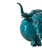 Glossy turquoise ceramic Ankole-Watusi sculpture with long, stylized horns and a nose ring.