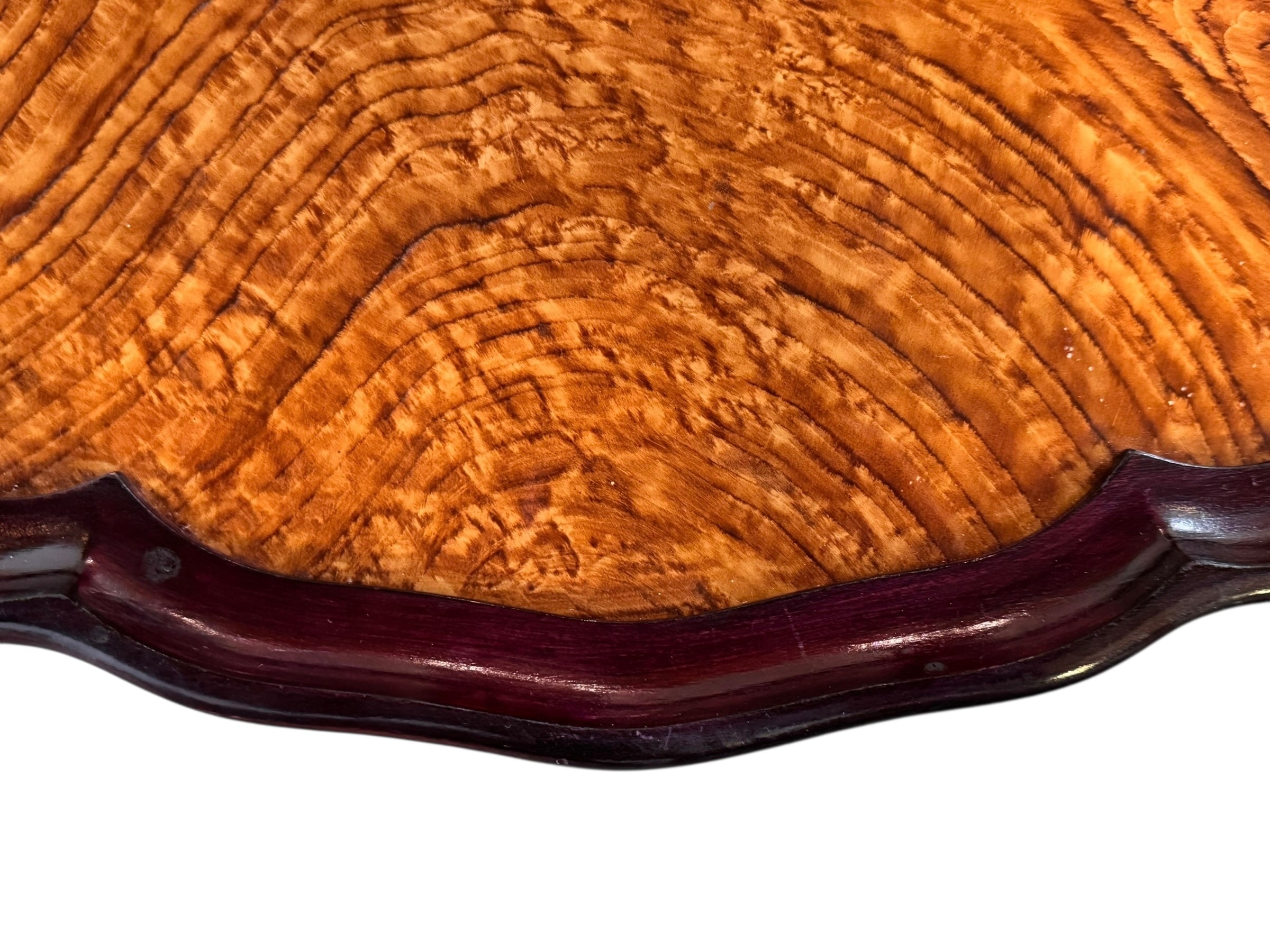 An ornate Art Deco serving tray featuring a highly figured burlwood center and silver-plated handles and rim