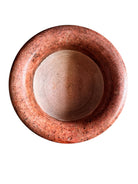 A carved pink granite planter with a leaf pattern, designed for indoor use without drainage.