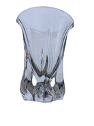 A clear crystal vase with a flared opening and a twisted, sculptural base.
The provided image is of a vintage Vannes Le Châtel crystal vase, which is a piece of French art glass