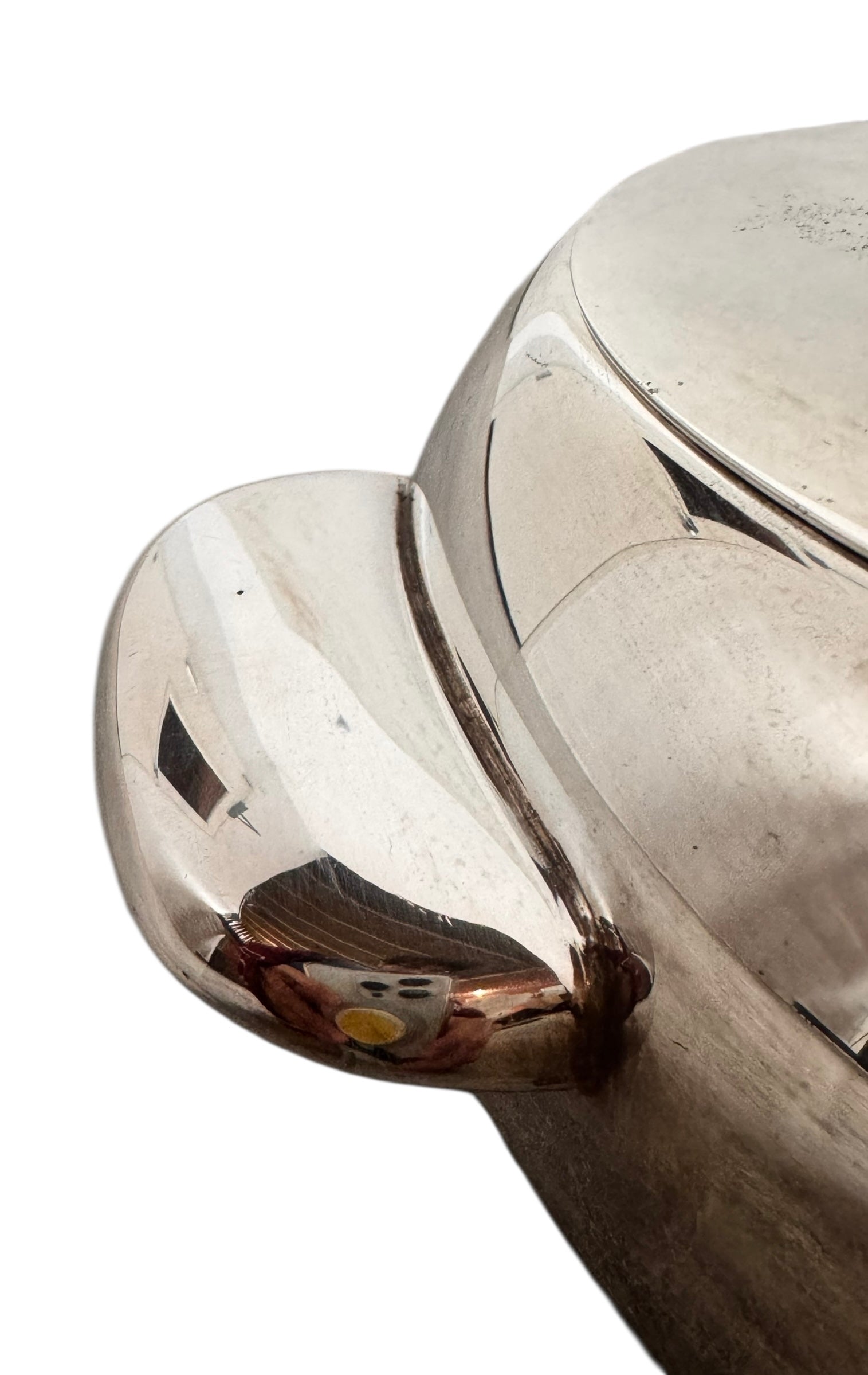 Round St. James silver-plated lidded serving dish from the 1980s, featuring a minimalist modernist design with geometric side handles and a sculptural, biomorphic finial, showing visible vintage wear and pitting on the metallic surface.