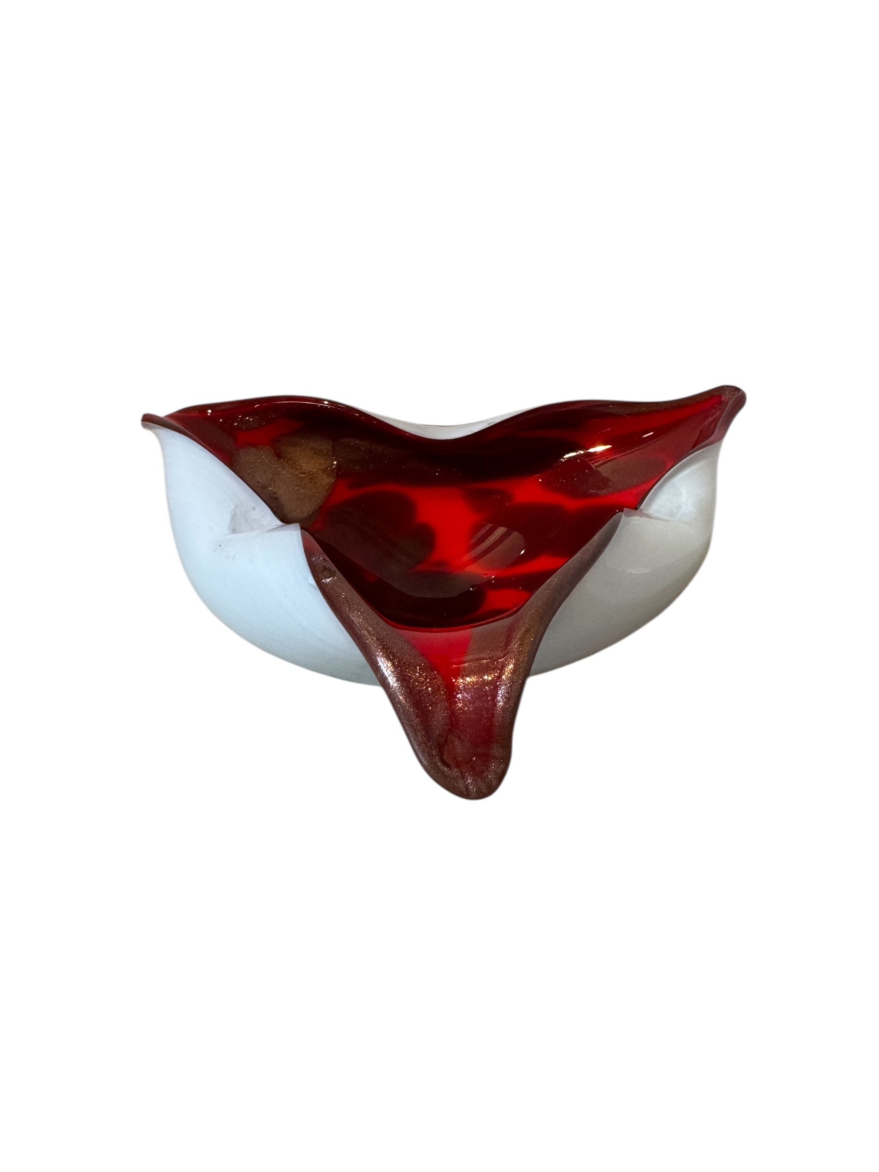 A vintage, hand-blown Murano glass piece shaped like a heart, with a vibrant red and gold-flecked interior encased in clear and opaque white glass