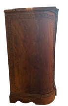 Antique bar cabinet with wood inlay and brass floral details, open to reveal interior shelving and bar storage