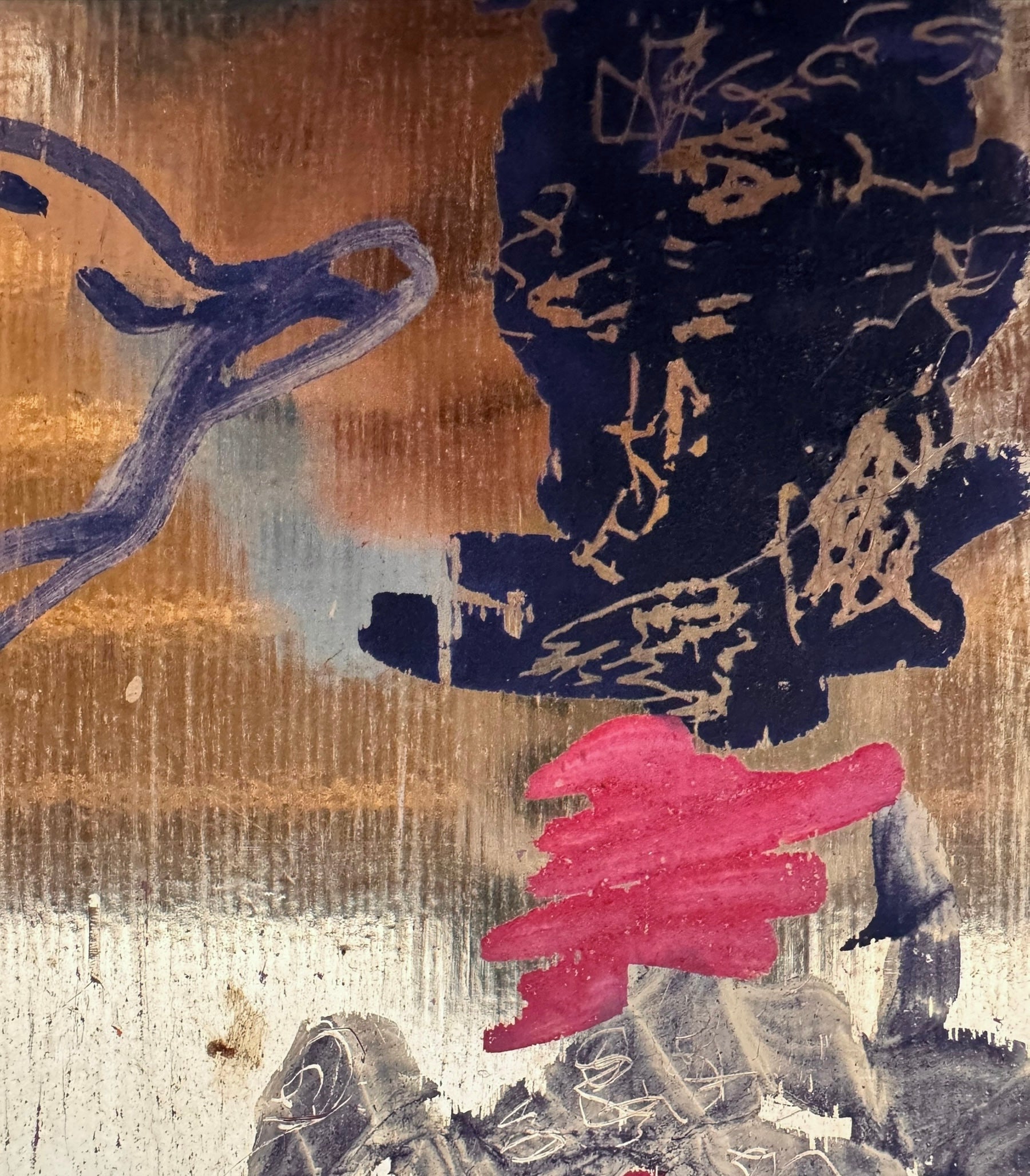 A vibrant abstract painting on a metallic gold-toned panel characterized by dense, energetic layering. The palette is dominated by saturated pinks, deep blacks, and earthy oranges.
In the upper half, horizontal strokes of orange and pink suggest a sunset or landscape, while the lower half features heavy, gestural applications of black paint that anchor the composition. Fine, white or silver linear scribbles are scratched into or layered over the pigment, adding a sense of frantic movement.