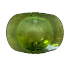 A vintage, Mid-Century Modern, peridot green art glass ashtray or catchall bowl with a curved, free-form design.