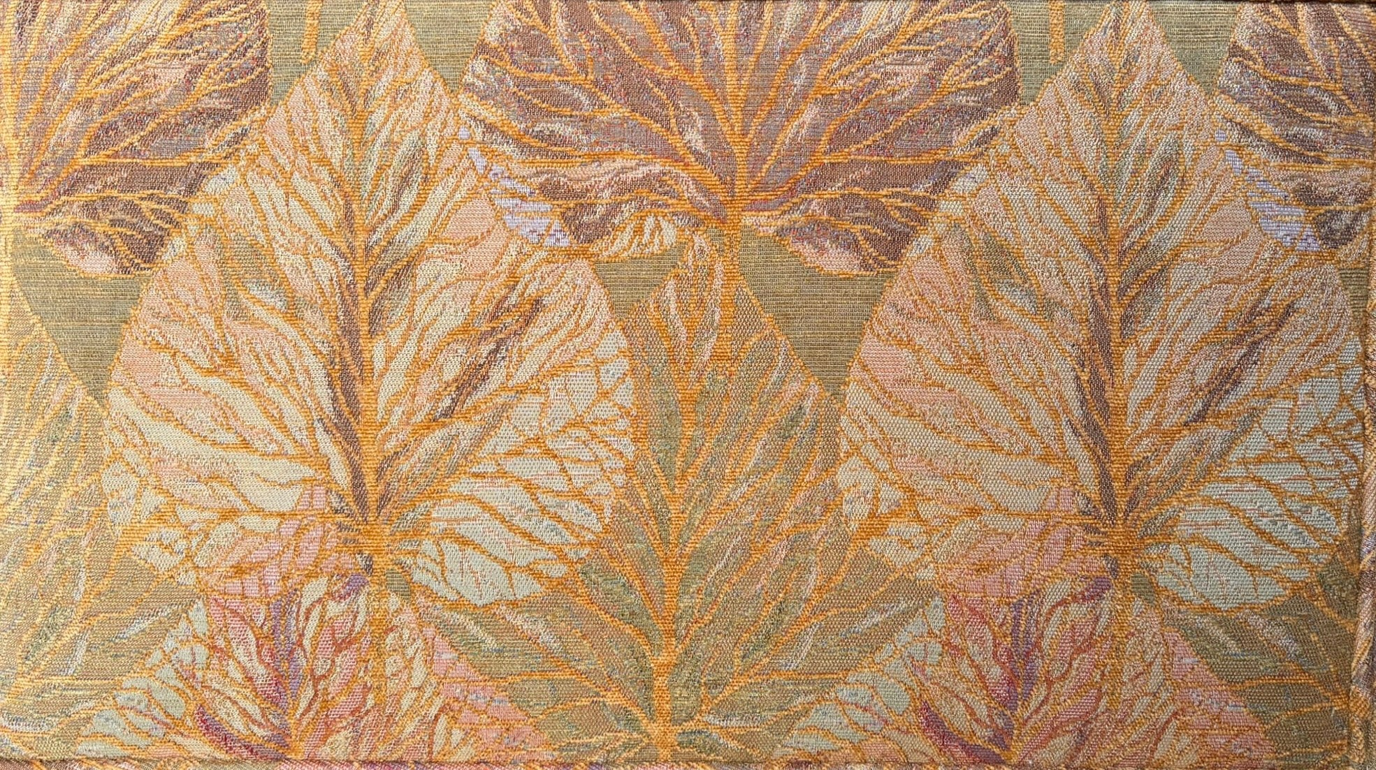 A Neoclassical-style wooden loveseat with a dark mahogany frame featuring scrolled arms and tapered legs. The upholstery consists of plush cushions and two matching cylindrical bolster pillows, all covered in a golden-yellow jacquard fabric with a large-scale, repeating autumnal leaf pattern in shades of muted orange and brown.