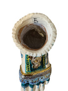 Close-up of Domenico Pinto's 'Mare Dentro' ceramic sculpture: foot, ship with gold sail, Apulian style