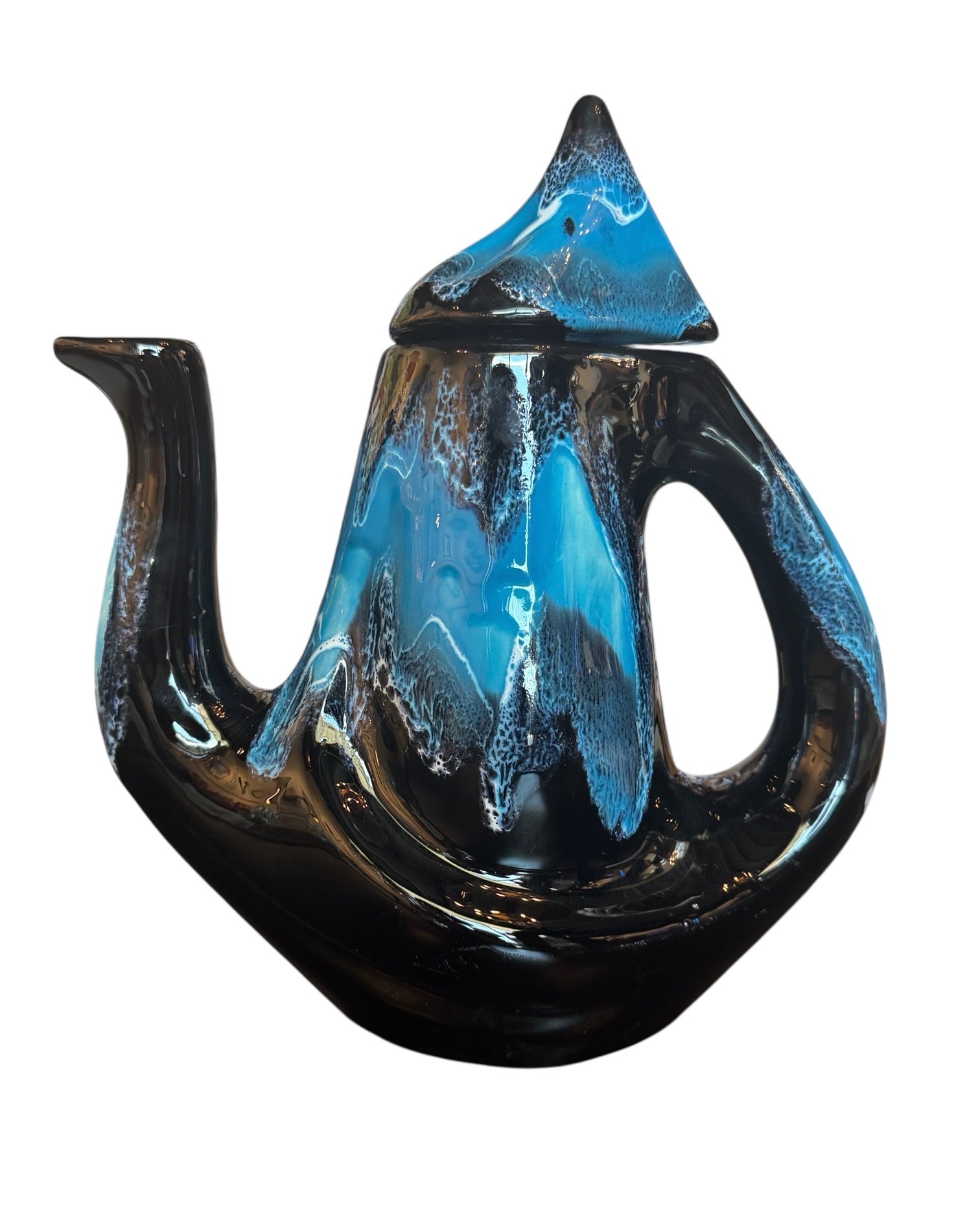 Complete mid-century ceramic tea set with teapot, sugar bowl, cups, and saucers, featuring a bold blue and black "lava drip" glaze reminiscent of Vallauris pottery.