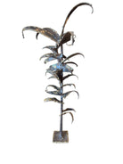 Mid-century Brutalist sculpture made of brass and bronze, depicting a stylized plant with textured, oxidized surfaces.