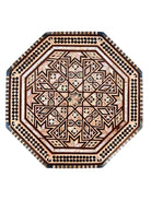 An ornate octagonal Syrian inlaid box, intricately decorated with geometric patterns made from dark wood, iridescent mother-of-pearl, vibrant abalone shell, and pale bone