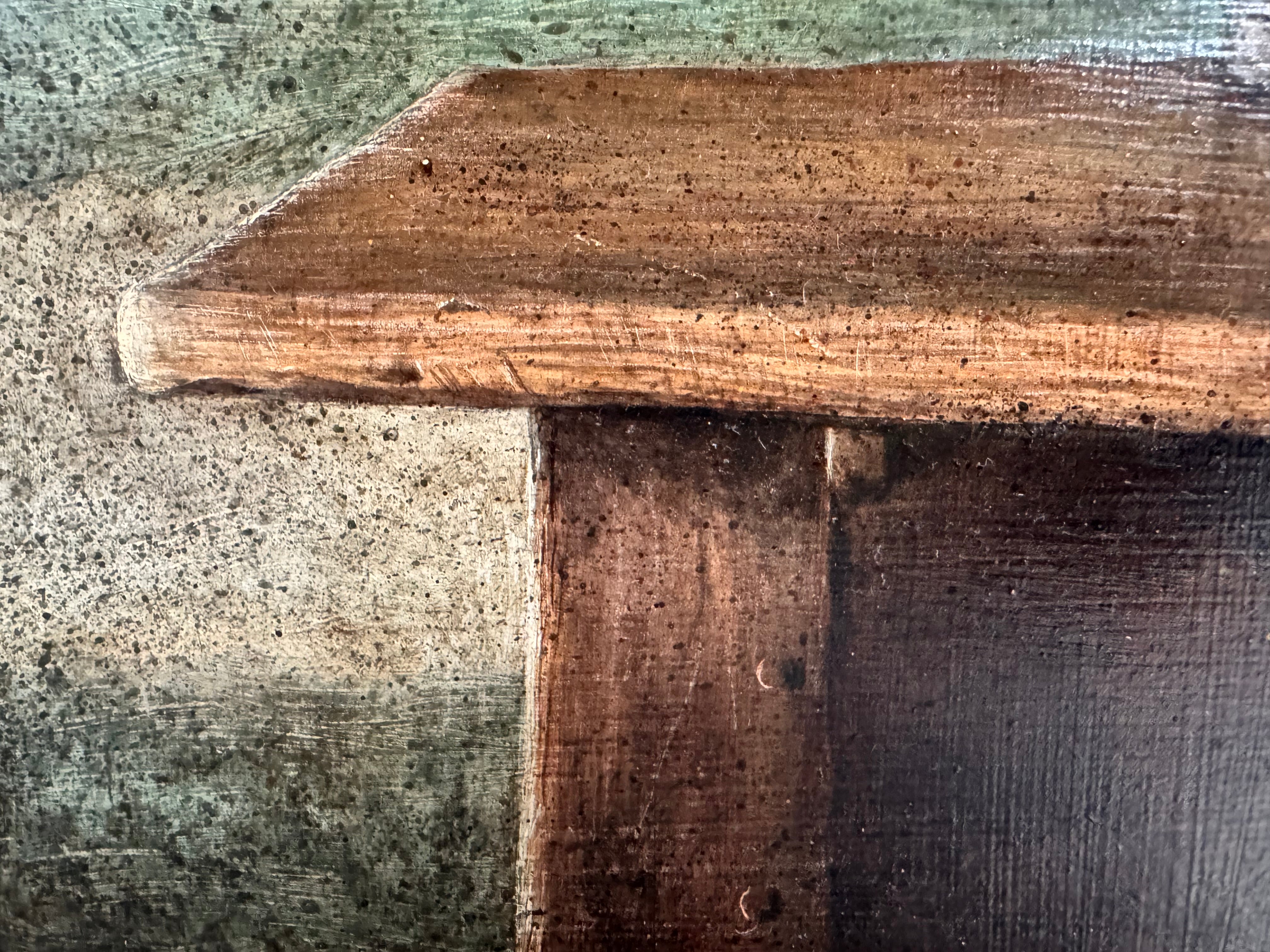 A realistic painting of a rustic interior scene by Travis Whitfield. A duck sits inside a woven basket on a dark wooden table with a single drawer. A French horn hangs on the light blue and white log wall behind the table. A multi-pane window on the left side of the painting shows an outdoor view. 
