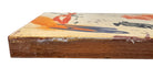 A vertical composition on a bright, reflective metallic background (likely silver or light gold leaf). The piece is defined by sparse, high-energy gestures: a sweeping arc of orange and red at the top, a central cluster of textured red paint, and a scattering of teal-blue "C" shapes and hooks. The metallic surface is highly visible, giving the piece a luminous, modern feel.