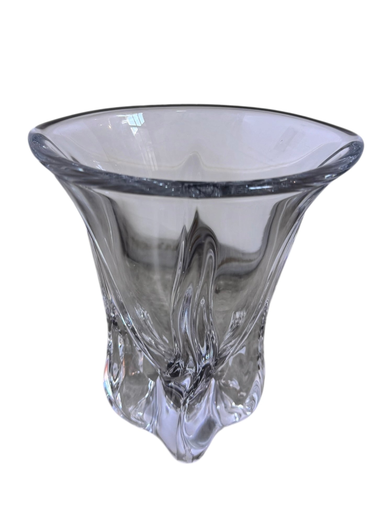 A clear crystal vase with a flared opening and a twisted, sculptural base.
The provided image is of a vintage Vannes Le Châtel crystal vase, which is a piece of French art glass