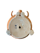 Terracotta colored ceramic Highland cow sculpture with a shaggy coat and curved horns