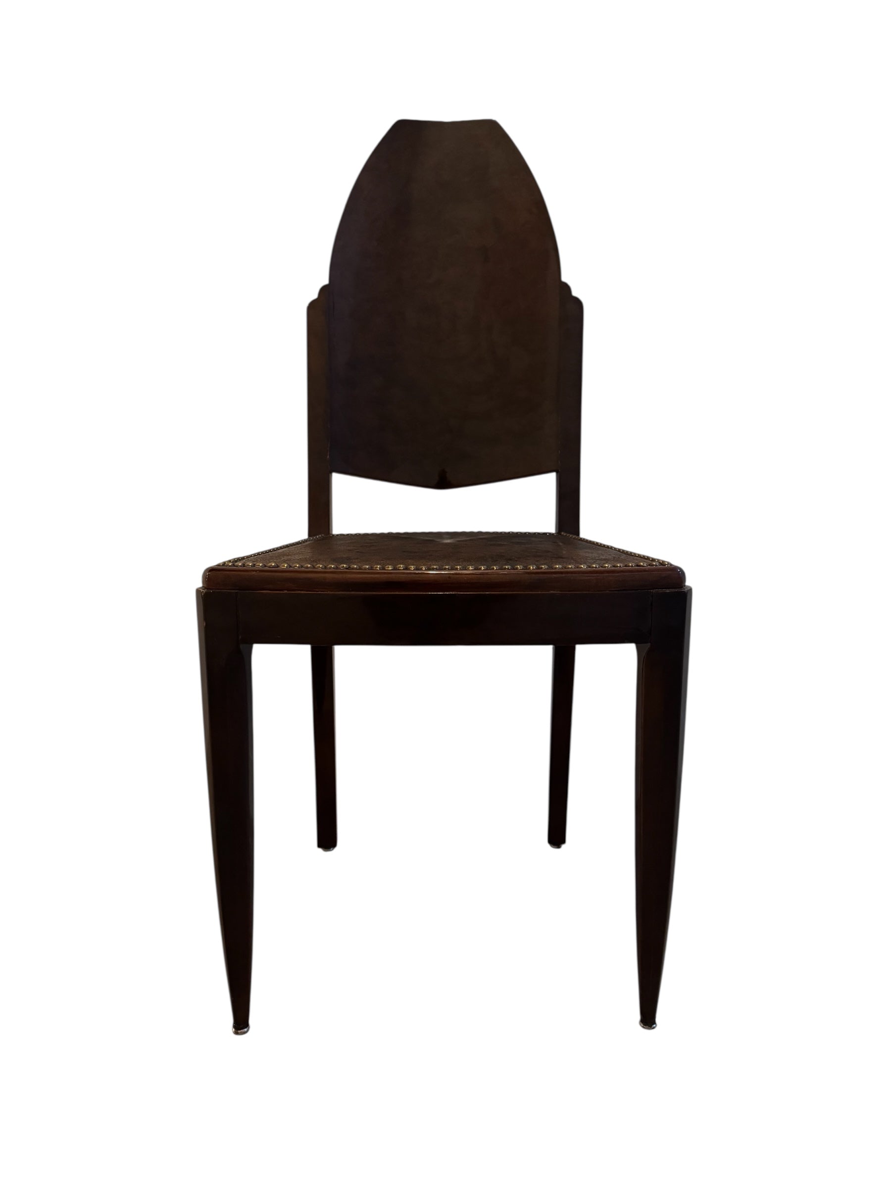  Art Deco chair featuring the leather upholstery, nail head trim, and mahogany frame.