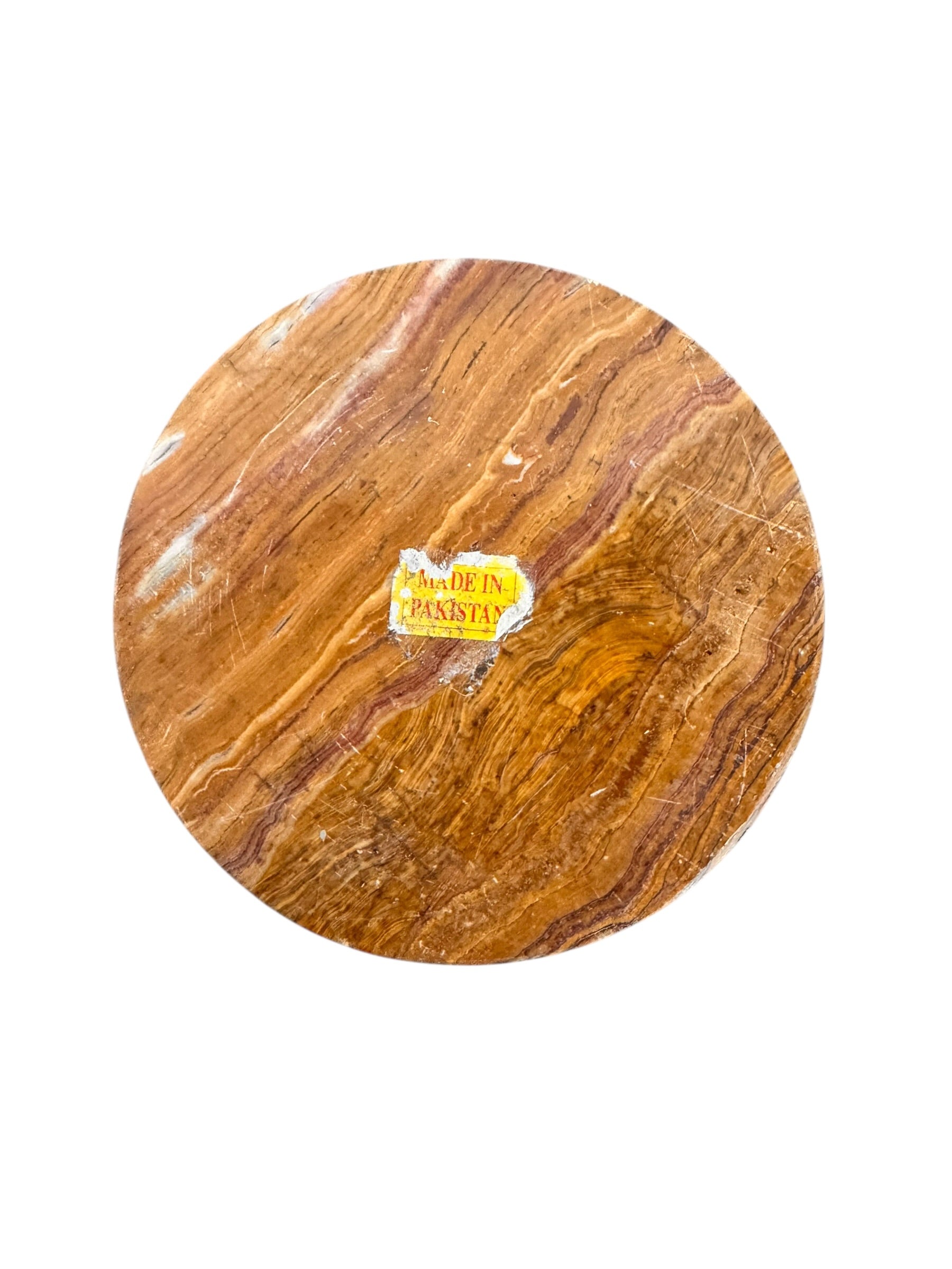 An elegant, hand-carved decorative vase made of polished Pakistani brown onyx. The vase features a classic, rounded urn shape with a tiered, flared neck and a solid matching spherical stone stopper resting on top. The stone displays rich, natural horizontal banding and swirling patterns in shades of honey, deep amber, rust-red, and cream. It stands on a small, integrated pedestal base against a clean white background, reflecting a high-gloss, mirror-like finish.