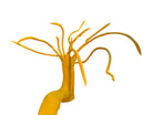 A bright yellow abstract sculpture depicting a calamari with a thick base and several thin, curving, branch-like extensions.