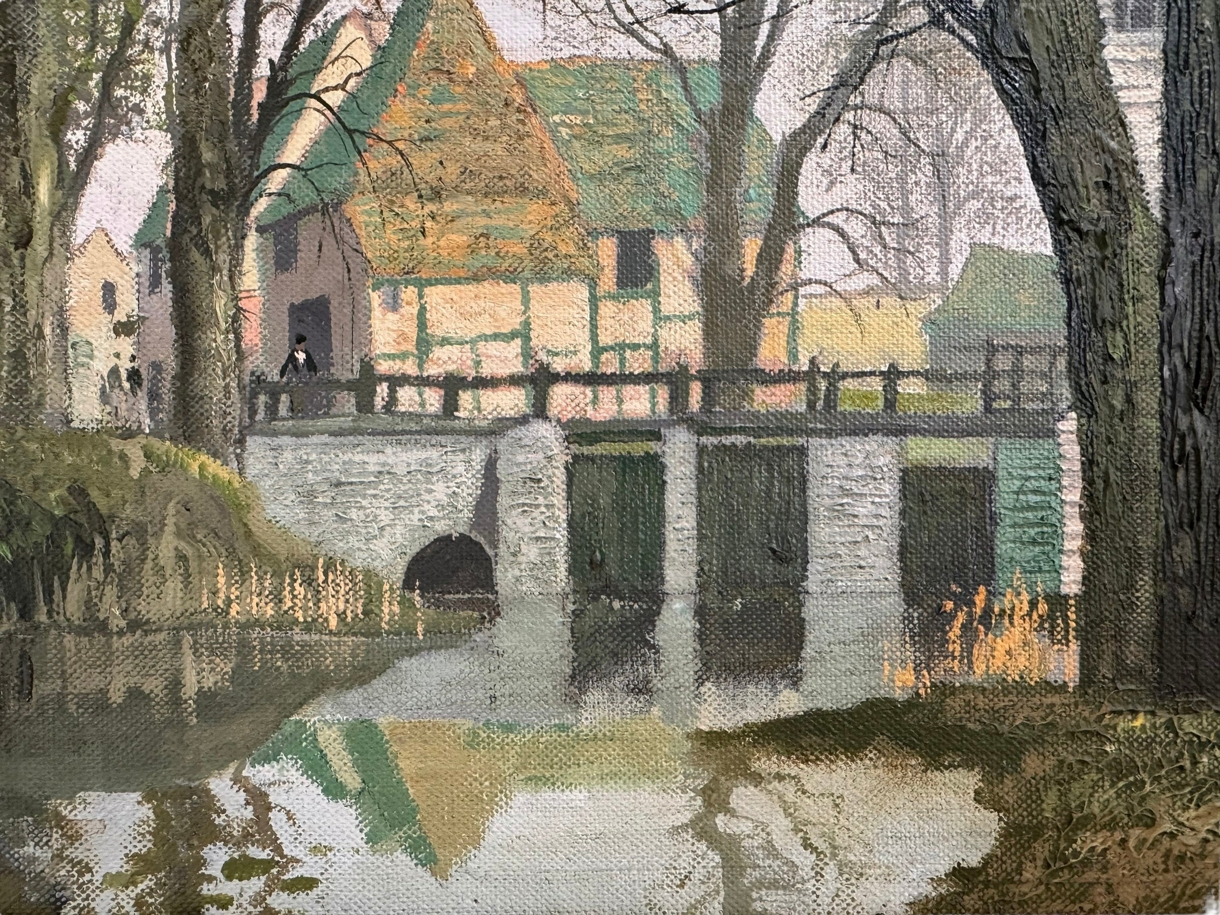 A naturalistic landscape oil painting by Michael Reilly titled "Mill Pond with Bridge" depicts a small town scene with a stone bridge over a mill pond, several buildings, and numerous bare trees under a grey sky