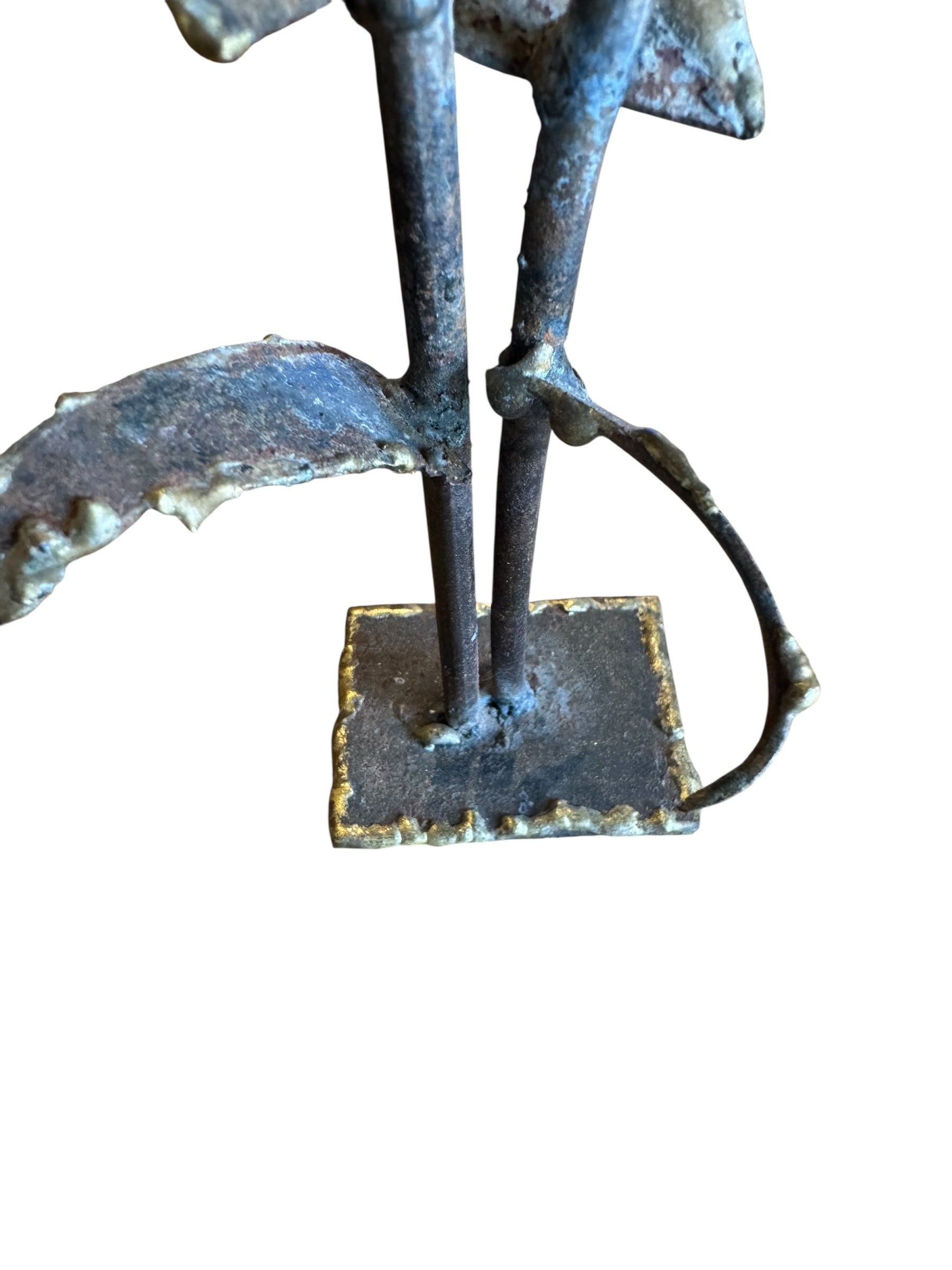 Mid-century Brutalist sculpture made of brass and bronze, depicting a stylized plant with textured, oxidized surfaces.