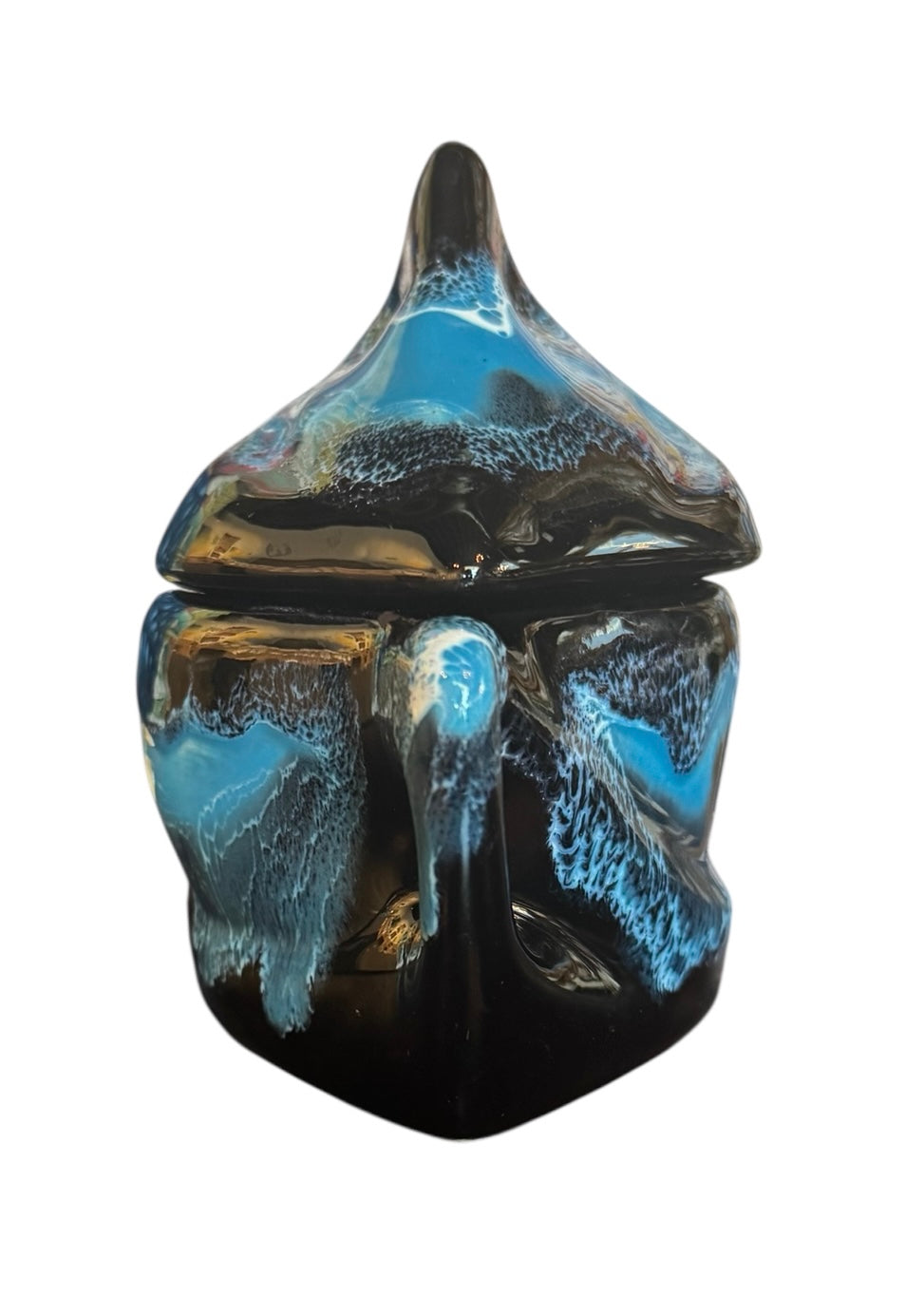 Complete mid-century ceramic tea set with teapot, sugar bowl, cups, and saucers, featuring a bold blue and black "lava drip" glaze reminiscent of Vallauris pottery.
