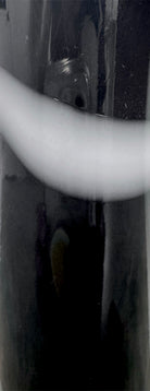 A sleek, hand-blown Polish art glass vase featuring a tall, slender neck that flares into a rounded, bulbous body. The vase is made of opaque black glass decorated with a continuous white spiral ribbon that winds around the entire piece from base to rim. The high-gloss, reflective surface creates sharp highlights, emphasizing its smooth, sculptural silhouette against a plain white background.
