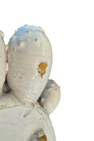 A white glazed ceramic platter in the shape of a prickly pear cactus pad with attached prickly pear fruit. The surface has raised dots representing spines