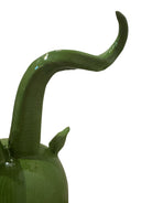 Glossy green ceramic pig sculpture with exaggerated, upward-curving horns and a snout.