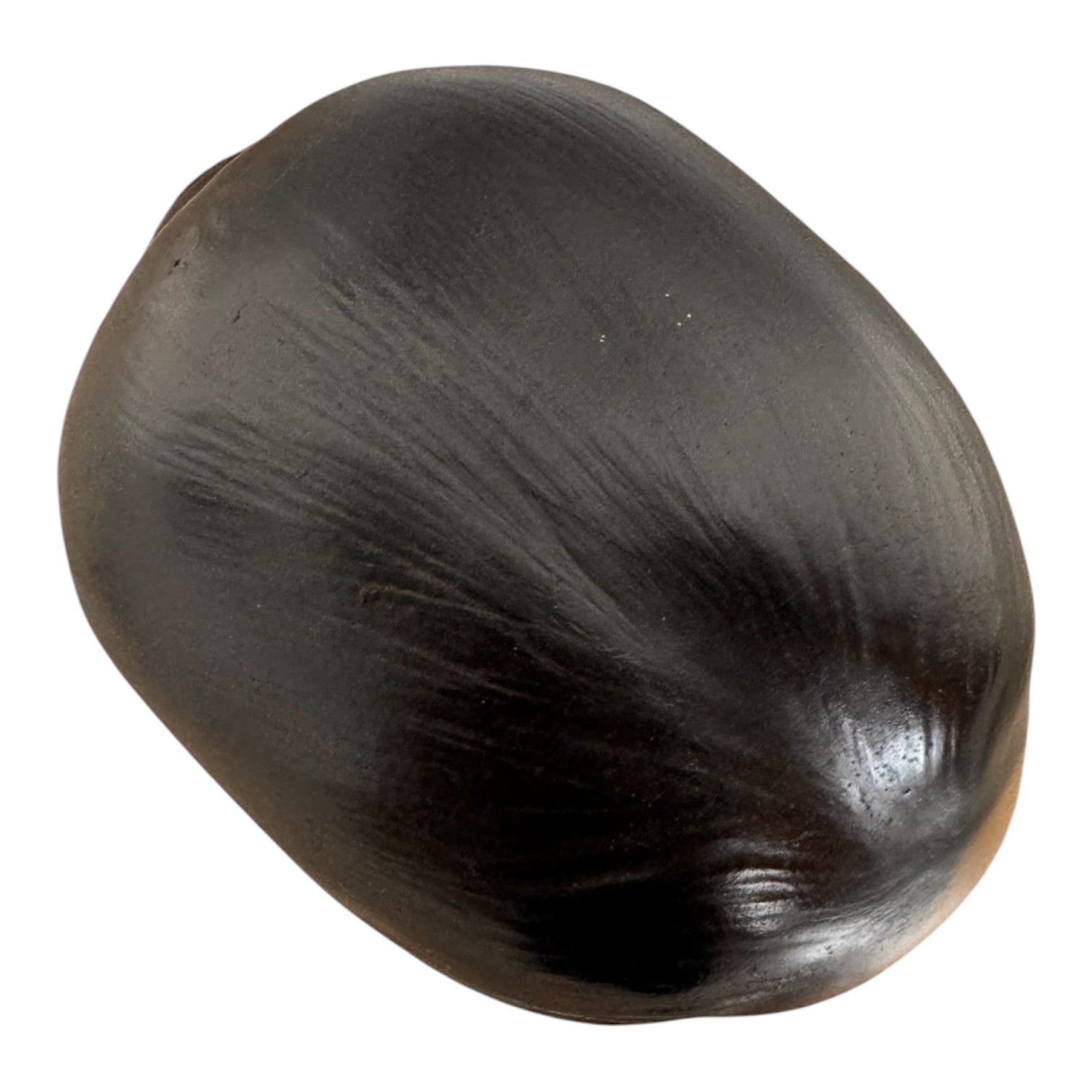 a vintage ceramic bust featuring a woman with brown skin, dark eyes, and orange lips. Her black hair is sleek and parted on the side, pulled back into a low style. She wears a small, round white earring in her right ear lobe. The bust includes her head, neck, and the upper part of her shoulders