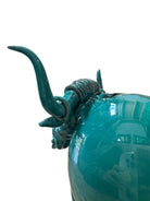 Glossy turquoise ceramic Ankole-Watusi sculpture with long, stylized horns and a nose ring.