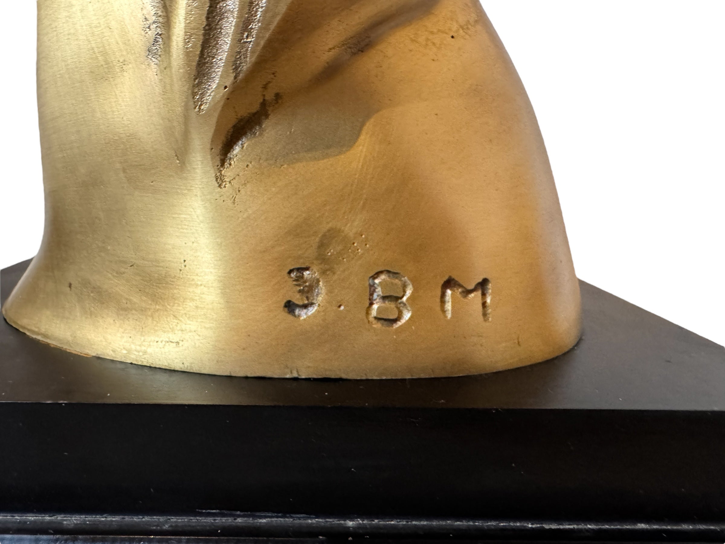 Cast bronze bust of a woman, mid-century Korean design, on a dark wood base. The figure has stylized flowing hair and no mouth.