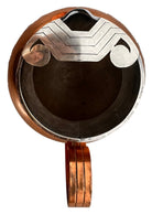 The set includes a large, rectangular, hammered copper tray with geometric openwork handles. Resting on the tray is a tall, slightly tapered copper coffee pot with a wooden handle, a matching smaller creamer pitcher with a similar wooden handle, a lidded sugar bowl, and a tiny matching metal cup or jigger. To the right off the tray sits a large, spherical copper water pitcher or jug with a wide mouth and ice lip.