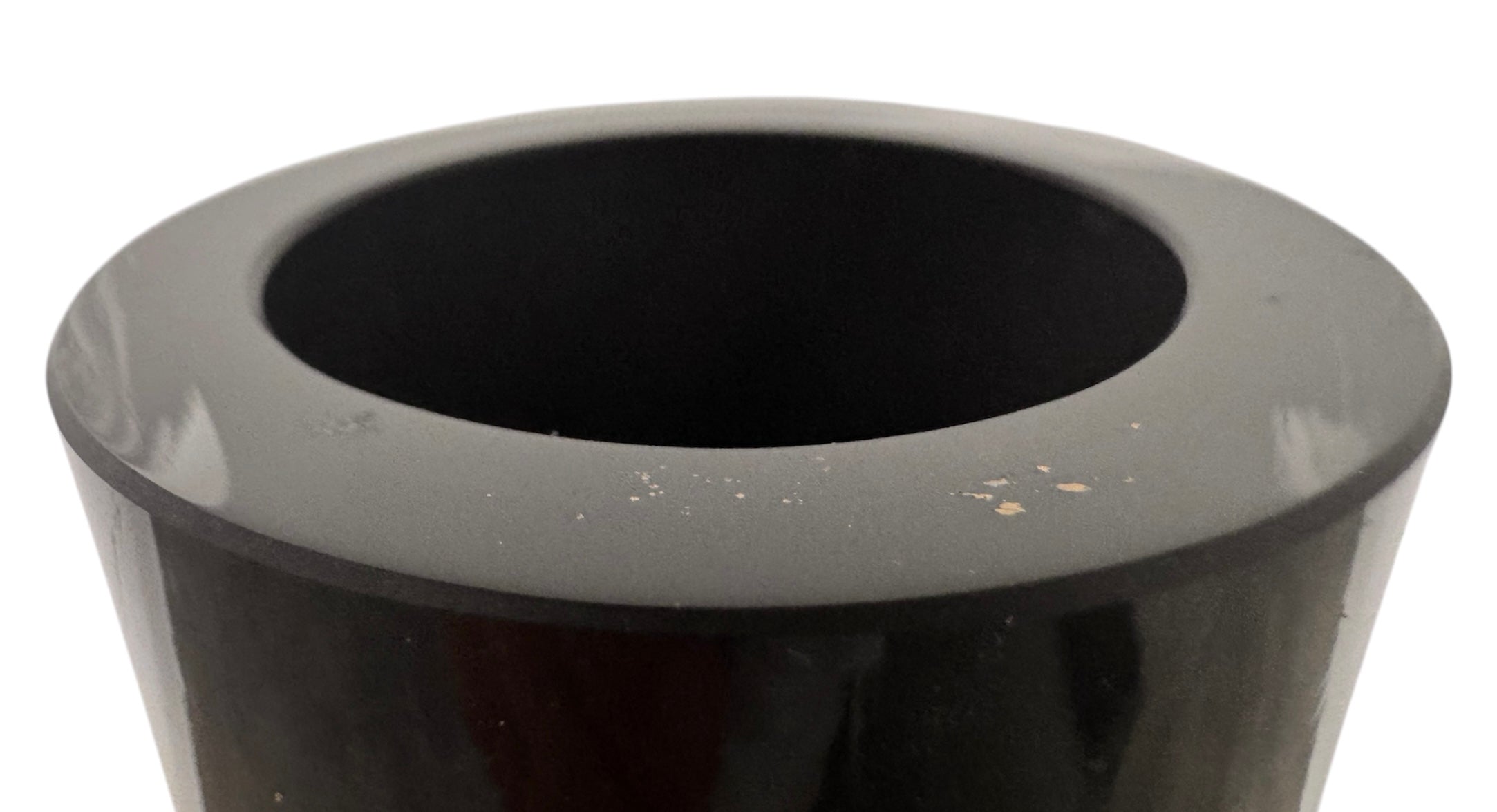 A sleek, hand-blown Polish art glass vase featuring a tall, slender neck that flares into a rounded, bulbous body. The vase is made of opaque black glass decorated with a continuous white spiral ribbon that winds around the entire piece from base to rim. The high-gloss, reflective surface creates sharp highlights, emphasizing its smooth, sculptural silhouette against a plain white background.
