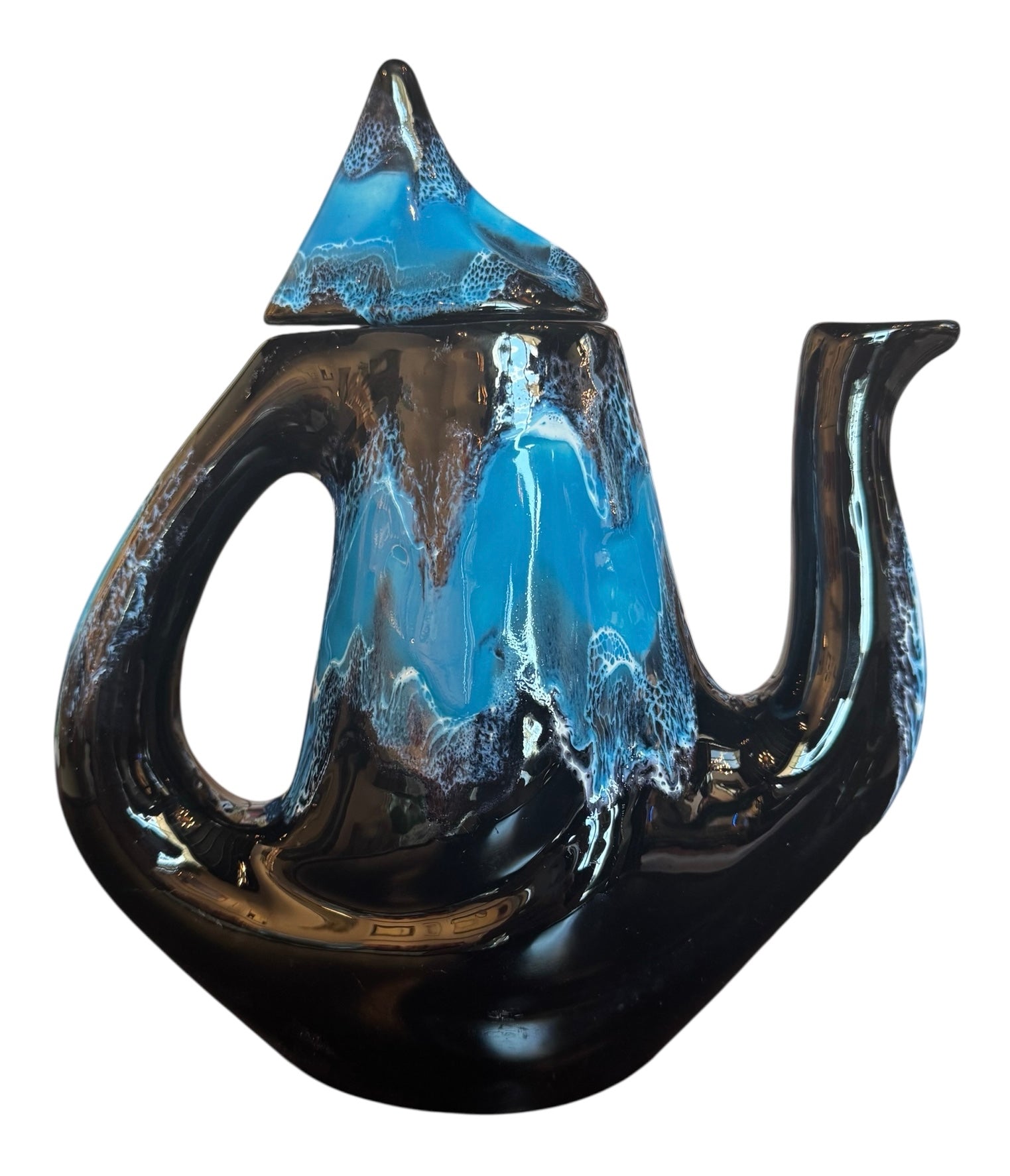 Complete mid-century ceramic tea set with teapot, sugar bowl, cups, and saucers, featuring a bold blue and black "lava drip" glaze reminiscent of Vallauris pottery.