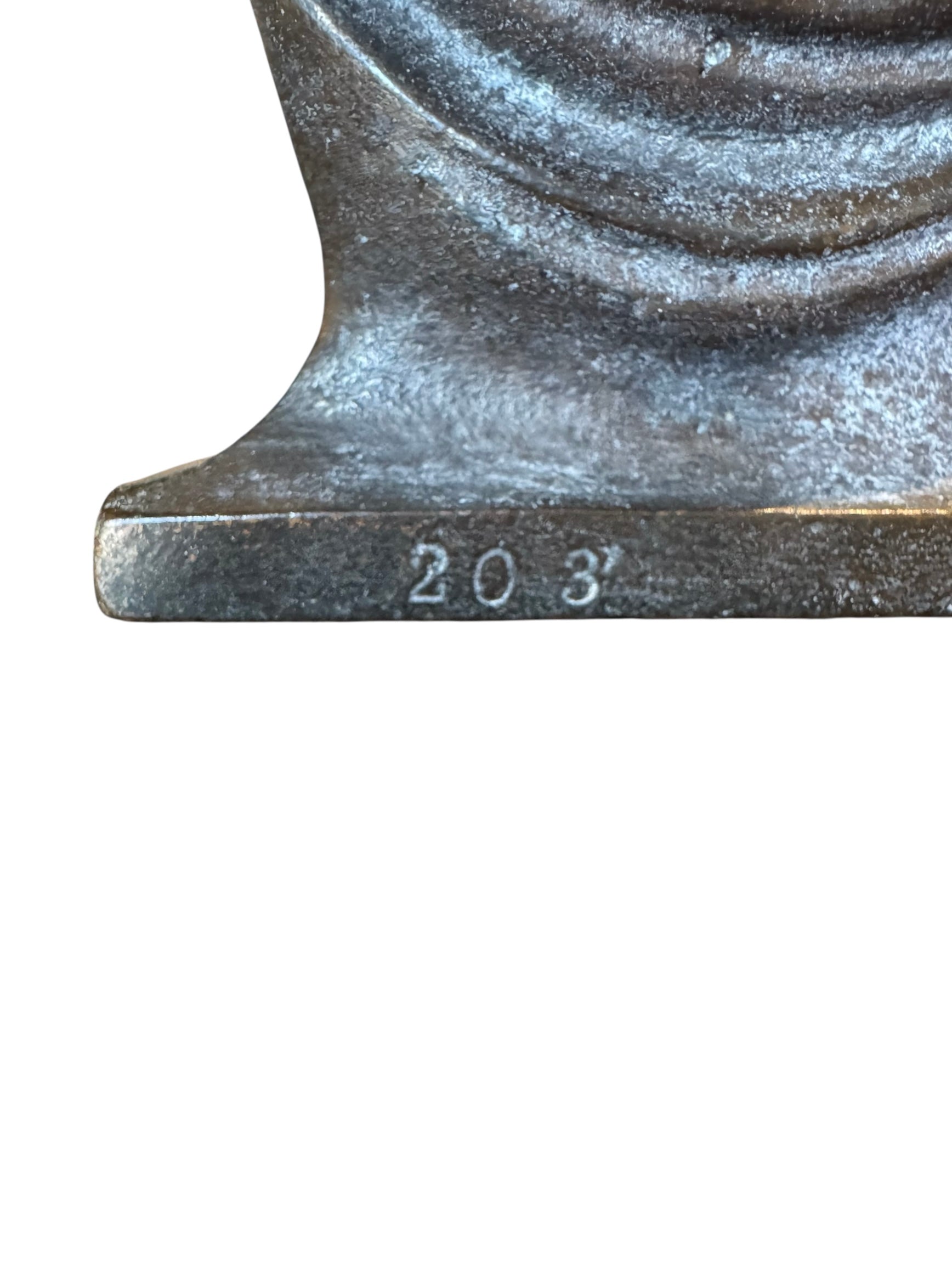 Two cast iron bookends in the Art Deco style. Each features a nude female figure leaning gracefully with one leg extended, posed atop a stylized wave or drape. The bookends have a bronze-colored finish and a vintage appearance.