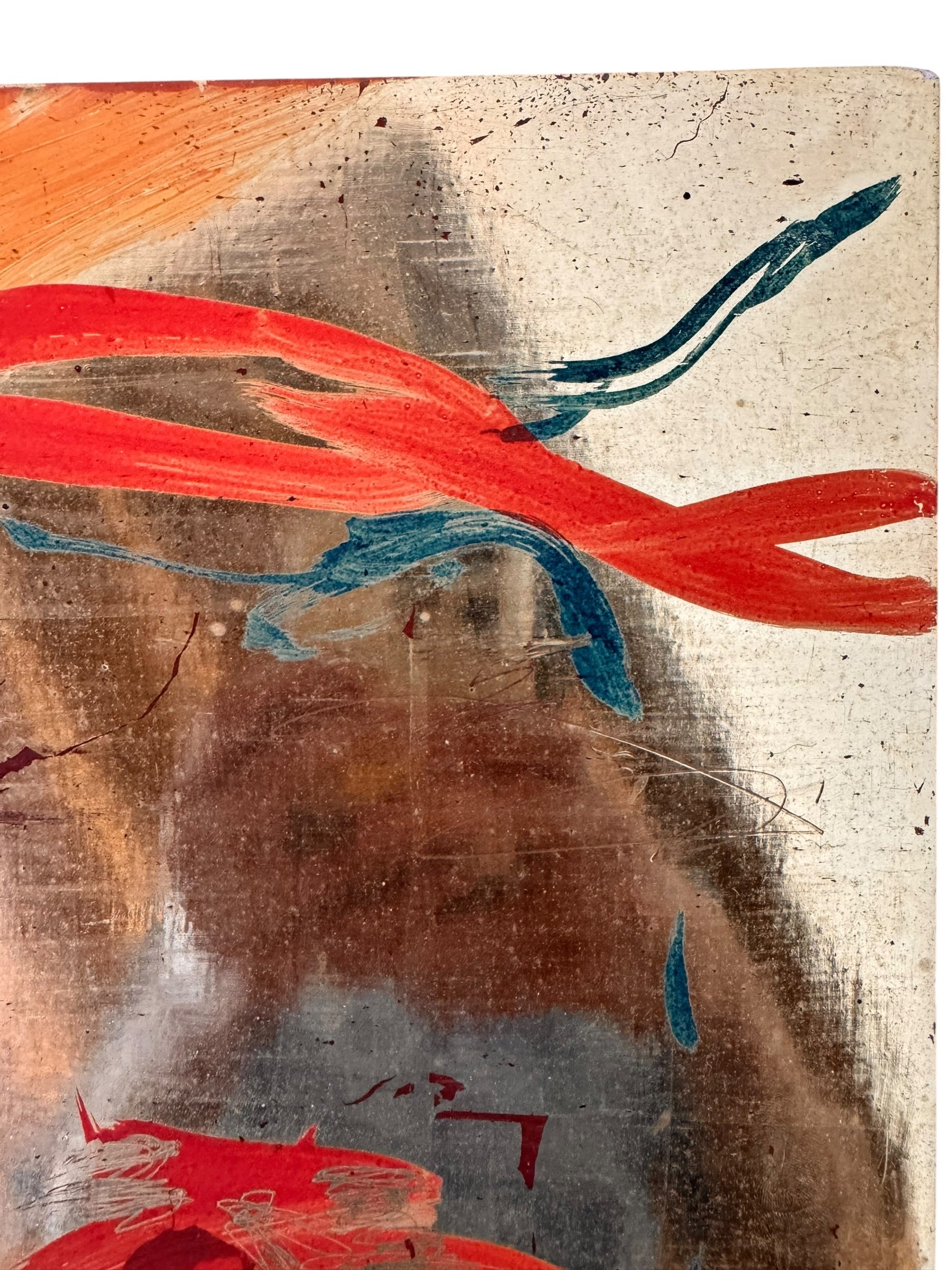 A vertical composition on a bright, reflective metallic background (likely silver or light gold leaf). The piece is defined by sparse, high-energy gestures: a sweeping arc of orange and red at the top, a central cluster of textured red paint, and a scattering of teal-blue "C" shapes and hooks. The metallic surface is highly visible, giving the piece a luminous, modern feel.