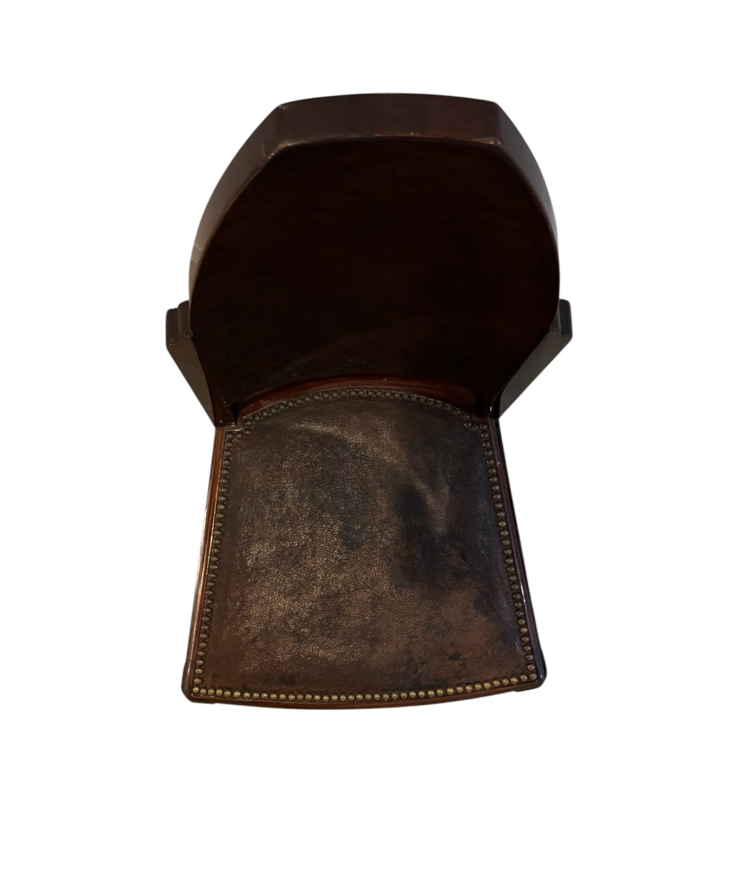  Art Deco chair featuring the leather upholstery, nail head trim, and mahogany frame.