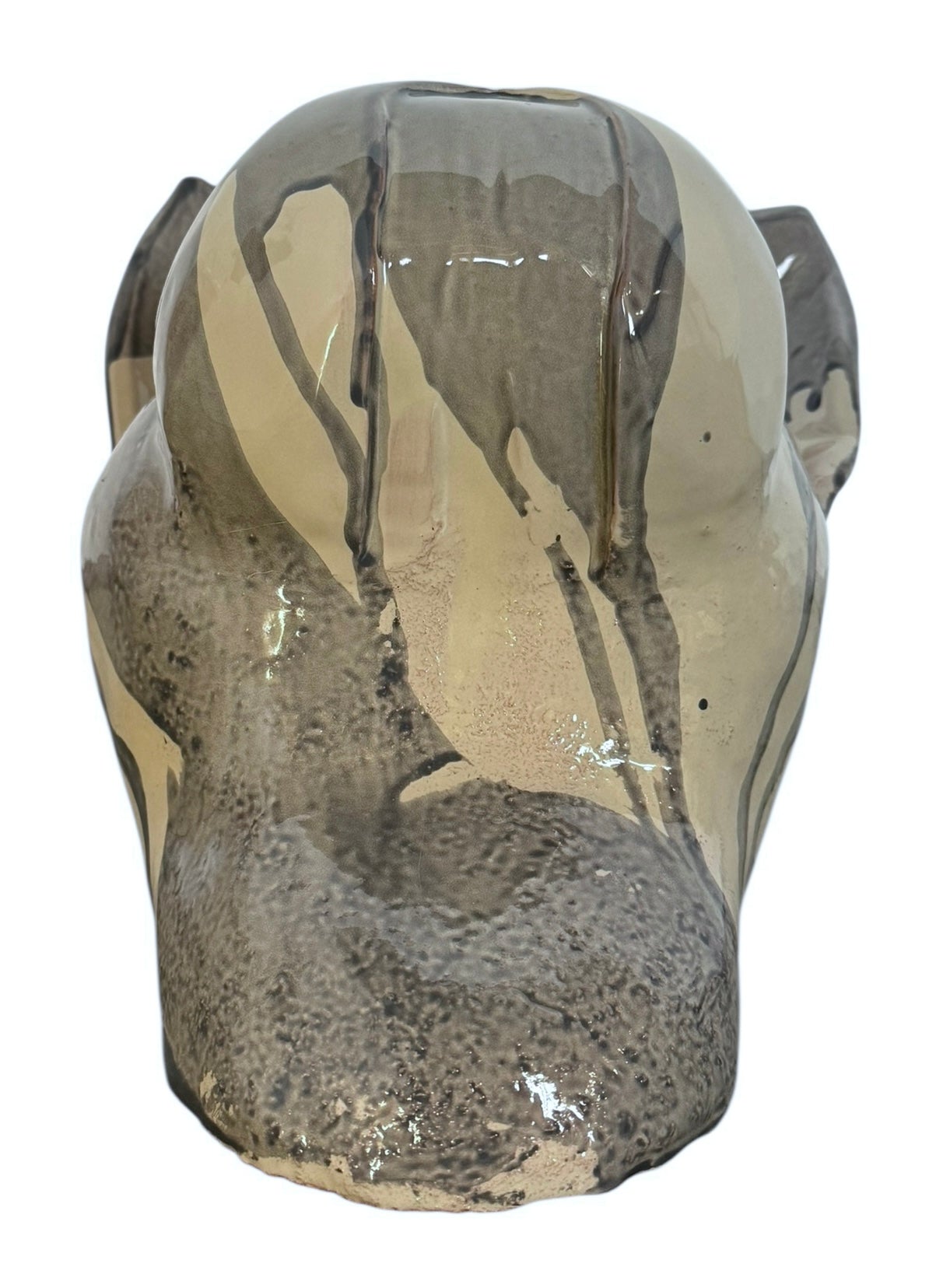 A ceramic sculpture of a bulldog's head by Enza Fasano. The piece features a glossy, glazed finish with a sophisticated color palette of muted greys, creams, and earthy brown tones arranged in bold, abstract striped patterns across the face and ears. The bulldog has characteristic folded ears, a prominent snout, and a soulful, slightly downturned expression. The sculpture is set against a clean, white background, highlighting its smooth texture and reflective surface.