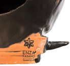 A smooth, dark black-colored ceramic sculpture of a Miniature Pinscher's head. The stylized dog features large, upright pointed ears and a prominent spiked collar around its neck. The surface has a soft sheen, with minimalist indentations for eyes and a rounded snout, creating a sleek and modern aesthetic.