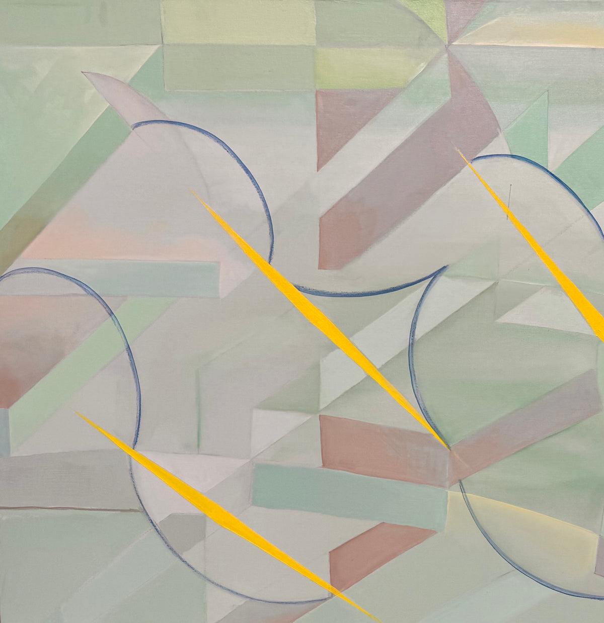 An abstract, horizontally oriented geometric oil painting framed in light natural wood. The composition features a complex, cubist-like lattice of interlocking planes, sharp angles, and transparent shards rendered in a soft, muted palette of pastel greens, lavender-grays, pale blues, and subtle pinks. Intersecting this subdued background are thin, dark blue sweeping arcs that trace circular movements across the canvas. Piercing through the composition are several sharp, dynamic, bright yellow shards shaped 